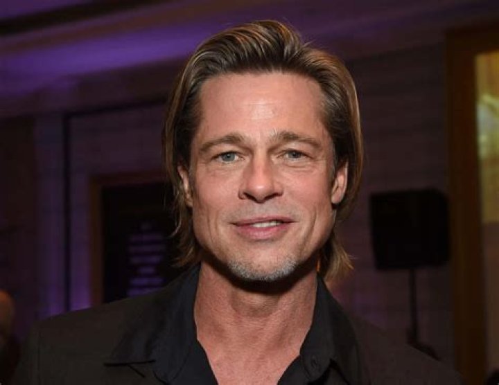 Brad Pitt Net Worth: Income & Charity Brad Pitt Smiling.